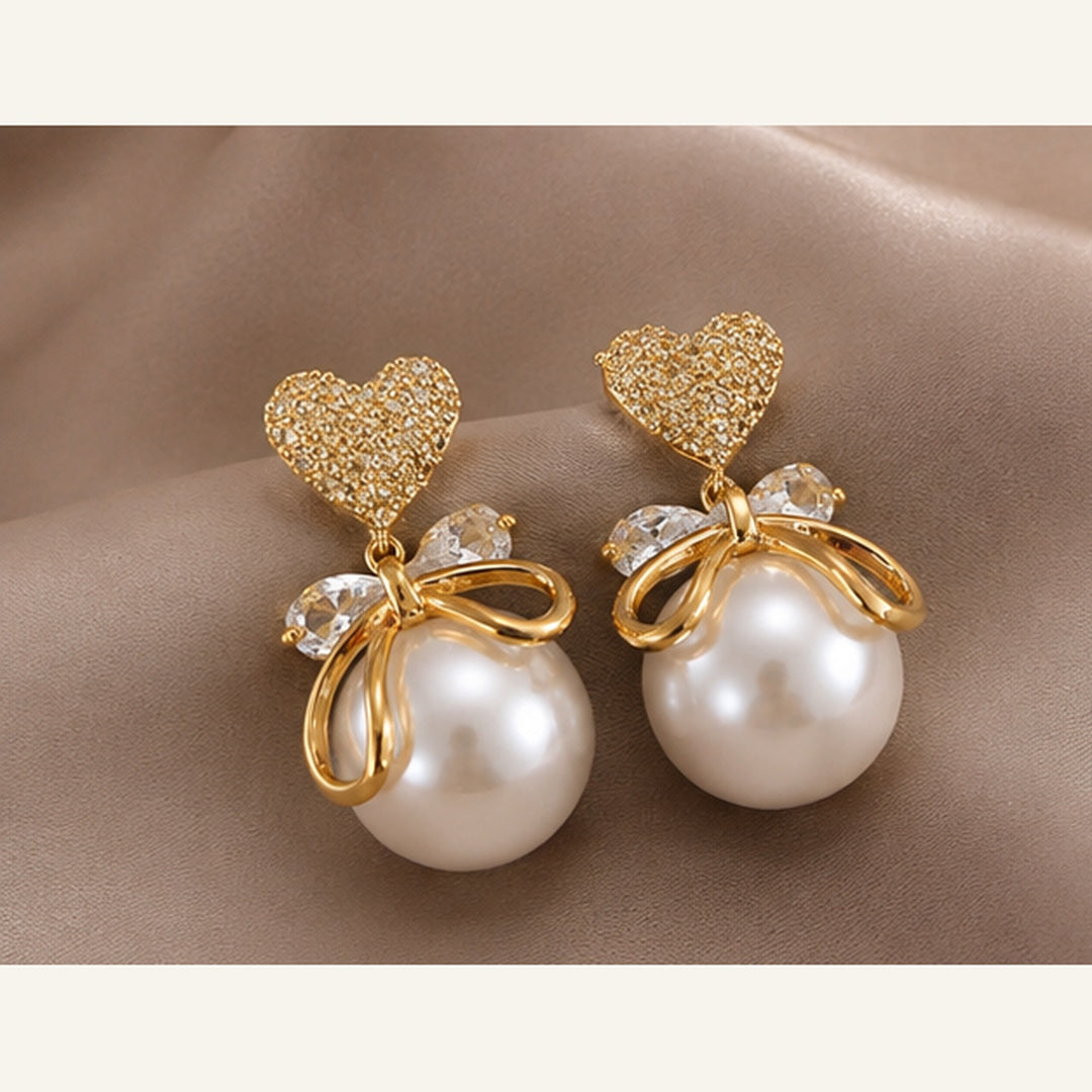 Swarnique Heart Pearl Bow Drop Earrings