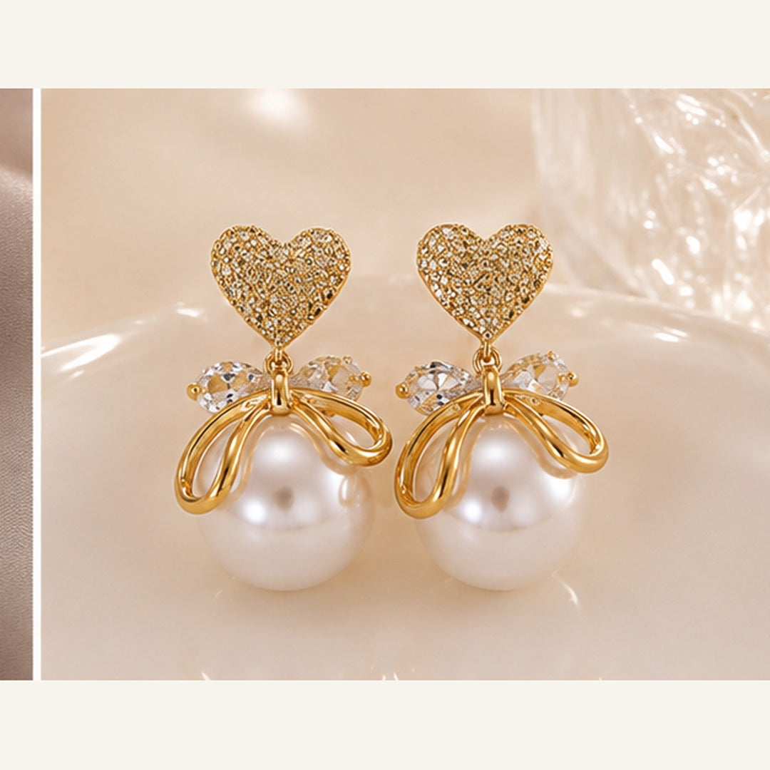 Swarnique Heart Pearl Bow Drop Earrings