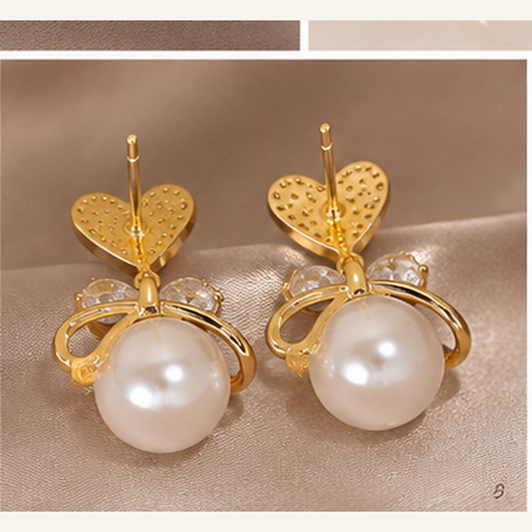 Swarnique Heart Pearl Bow Drop Earrings