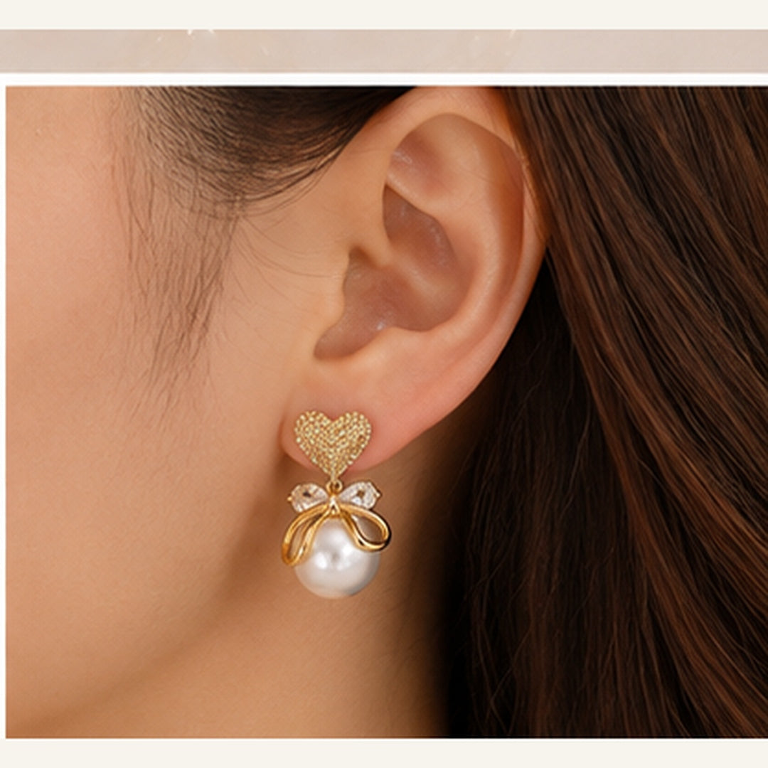 Swarnique Heart Pearl Bow Drop Earrings